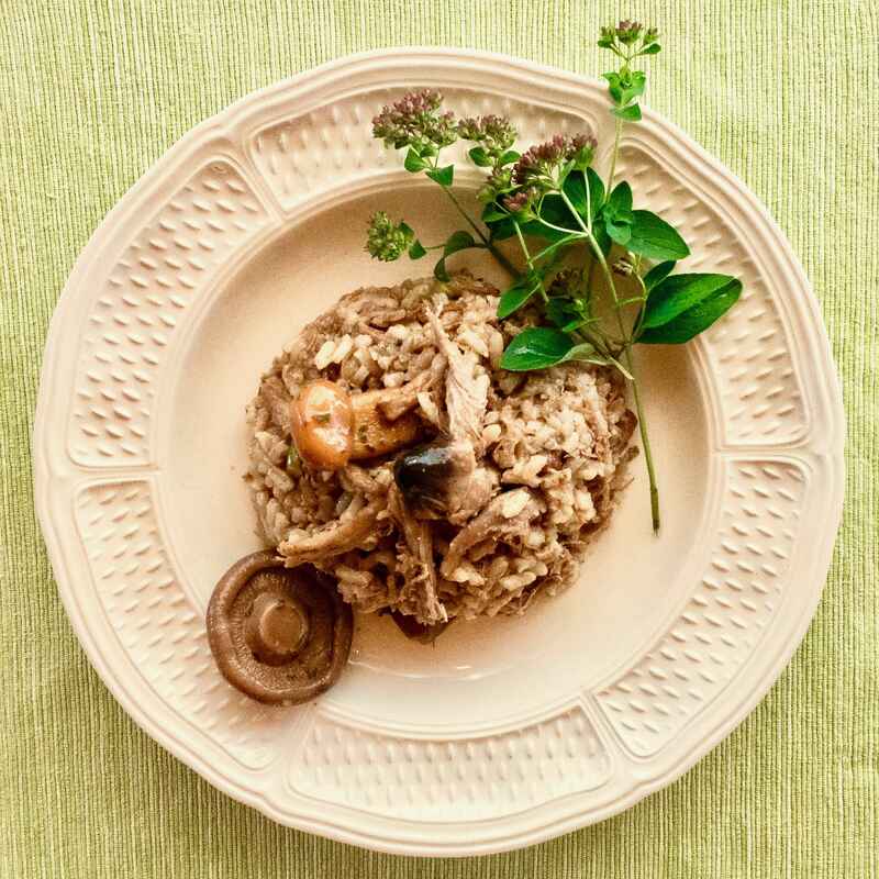 Risotto de canard confit et champignons mixtes aromatisé à l'huile de truffe